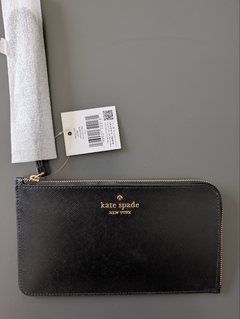NWT kate spade black and gold leather zip wristlet